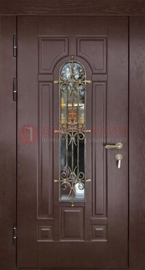 Темная железная дверь со стеклом и ковкой для частного дома ДСК-156 в Чебоксарах